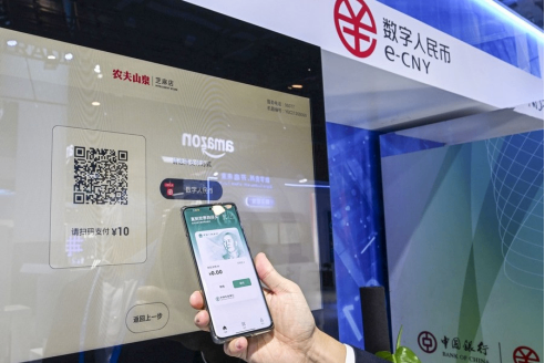 A judge's gavel resting on a pile of one-dollar bills