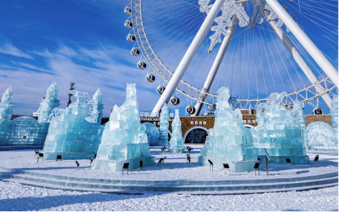 A man standing in a store with his hands on his hips, surrounded by TVs.