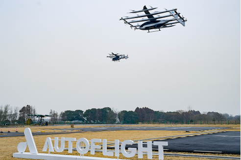 A CALIFORNIA GROUND SQUIRREL IN CONTA COSTA COUNTY RUNS WITH A VOLE IT HUNTED IN ITS MOUTH.